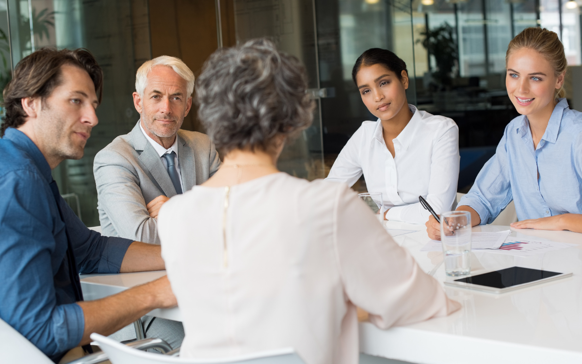 Team members communicating and collaborating together