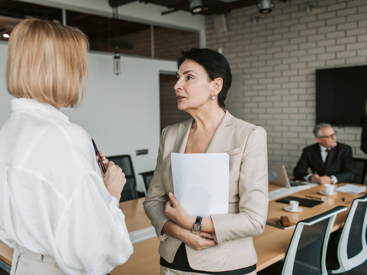Coworkers navigating a difficult workplace conversation