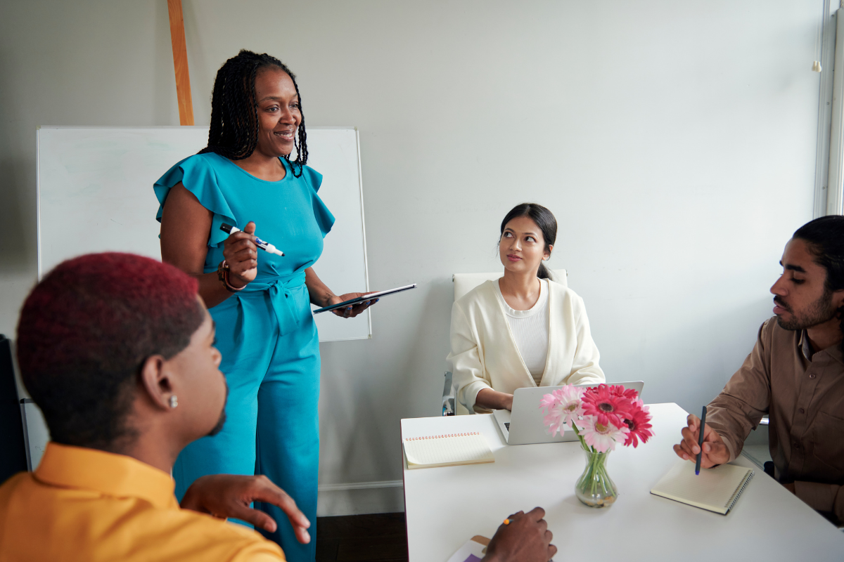 Manager meeting with a workplace team